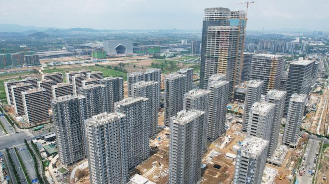 Photo taken on July 17, 2023 shows newly built commercial houses in Hangzhou, East China's Zhejiang province.