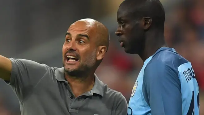 Mkufunzi Pep Guradiola na kiungo wa kati Yaya Toure