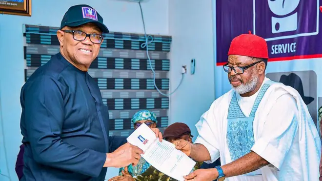 Peter Obi holding certificate