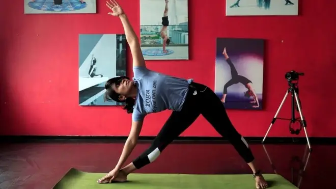 File photo of yoga teacher demonstrating a pose in Colombo, Sri Lanka