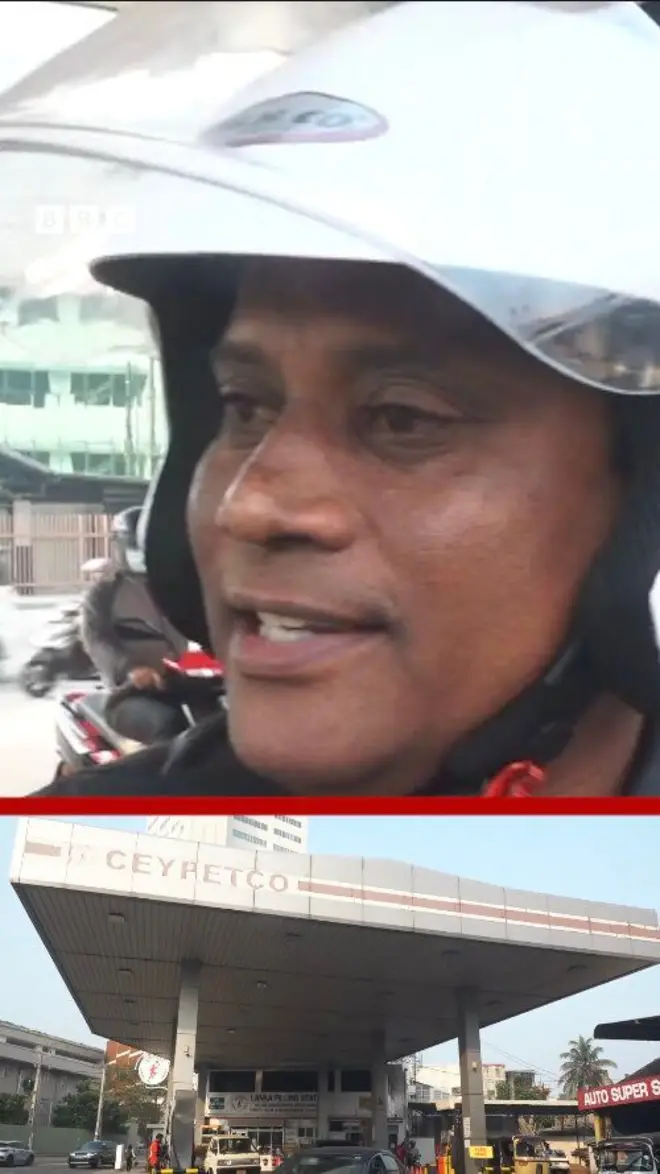 ඉන්ධන පිරවුම්හලක් ඈතින් දිස්වෙන අතර හෙල්මට් එකක් පැළඳි පුද්ගලයෙකු සිටියි.