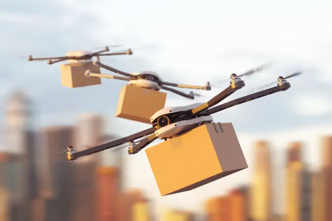a mockup of three delivery drones flying with carton boxes on city background