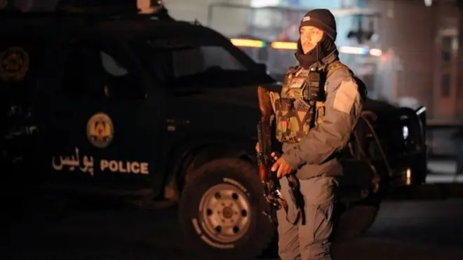 Afghan police stand guard at the governor's compound in Kandahar