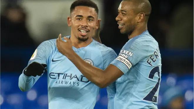 Gabriel Jesus and Fernandinho celebrate Manchester City's win at Everton