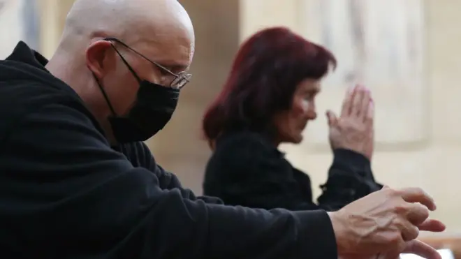 People praying in NYC church