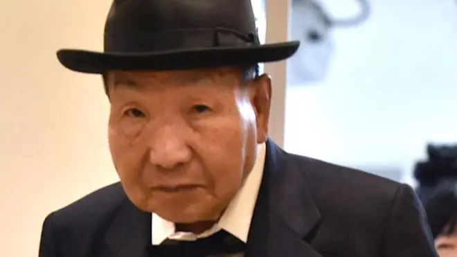 Japanese professional boxer Iwao Hakamada (L), who was sentenced to death for the murder of four members of a family in 1966 and released in 2014, leaving a press conference on 25 November 2019 in Tokyo