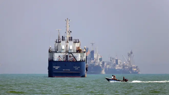 Close up of large tankers and boats in the the Strait of Hormuz
