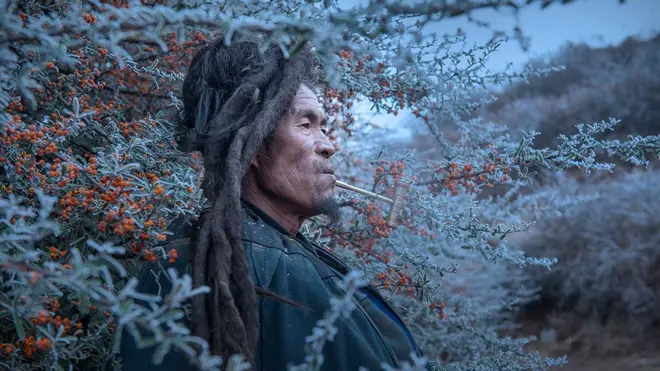 чоловік, що курить люльку, Китай