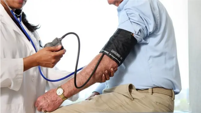 doctor taking blood pressure