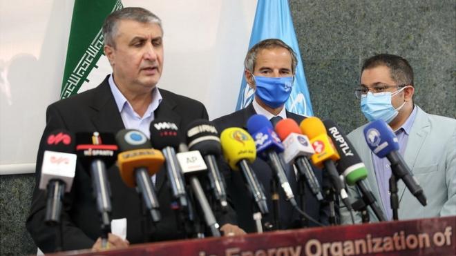 Director general of the International Atomic Energy Agency (IAEA), Rafael Mariano Grossi (C) and Vice president and Chief of the Atomic Energy Organization of Iran (AEOI), Mohammad Eslami (L) give a joint press conference in Tehran, Iran on September 12, 2021