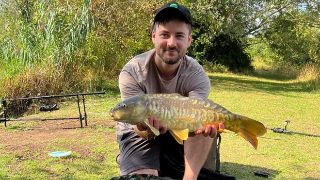 Fishing Backgrounds Young Man Hold Big Carp In His Hands Stock