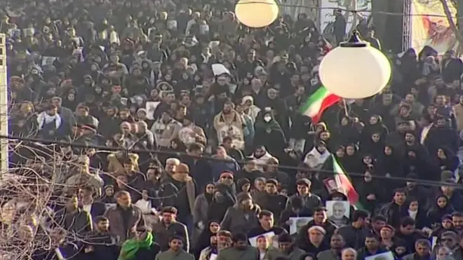 Mourners turn out for burial of military commander