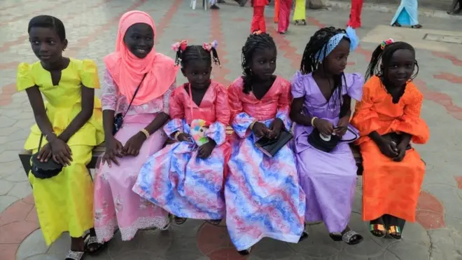 On the same day in Senegal's capital Dakar, these girls wear bright and beautiful dresses for Eid al-Adha celebrations