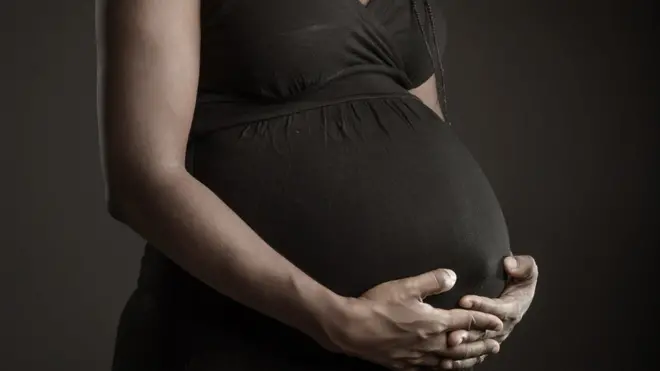 Pregnant mother with young child