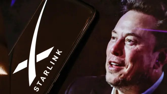 Screenshot of one screen wey dey display portrait of Elon Musk alongside di black and white Starlink logo ontop smartphone.