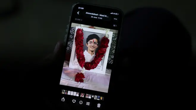 Prashant Patel, 45, shows a photo of his 17-year-old son Kahaan Patel, who took his own life ahead of the NEET exam retest, in Ahmedabad, India, July 21, 2026. REUTERS/Amit Dave