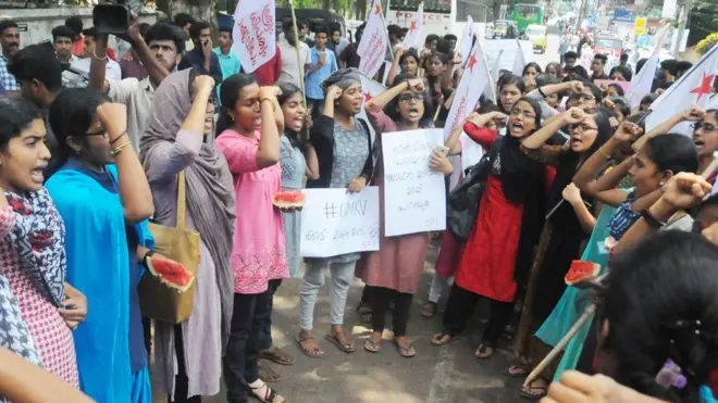 Protesters held slices of watermelon while demonstrating against the remarks