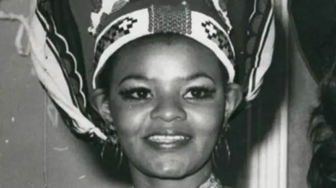 A black-and-white close up image of Cynthia Shange smiling