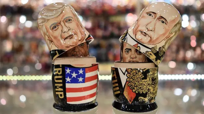 This picture taken on July 6, 2017, shows traditional Russian wooden nesting dolls, called Matryoshka dolls, depicting US President Donald Trump (L) and Russia"s President Vladimir Putin (R) at a gift shop in central Moscow. US president Donald Trump is due to meet his Russian counterpart Vladimir Putin on July 7, 2017 during G20 summit in Germany.