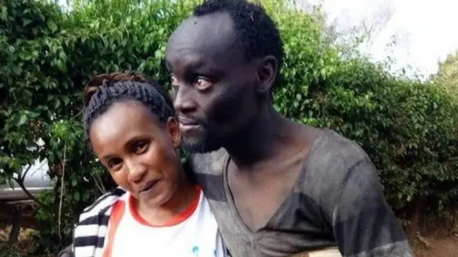 Wanja and Hinga hug in the street.