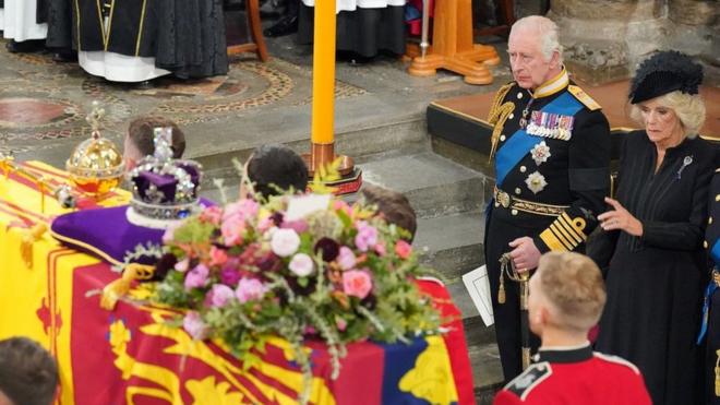 King Charles watches the funeral service