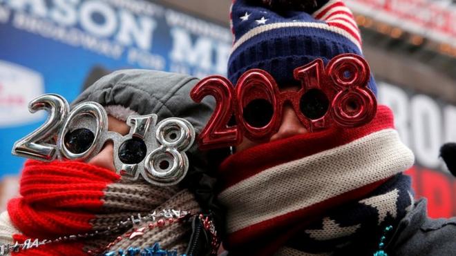 Revelers gather in Times Square as a cold weather front hits the region ahead of New Year"s celebrations in Manhattan, New York, U.S., December 31, 2017.
