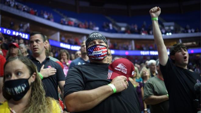 Supporters participate in the Pledge of Allegiance during a campaign rally for President Donald Trump at the BOK Center, June 20, 2020 in Tulsa, Oklahoma