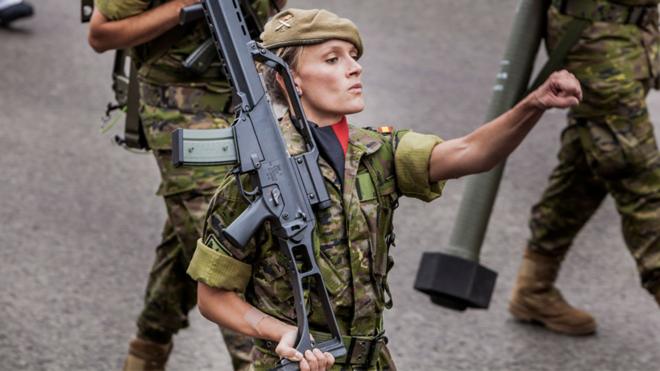 Woman soldier marching in Madrid, 12 Oct 18