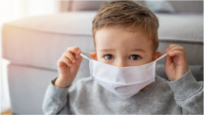 young boy wearing a face mask