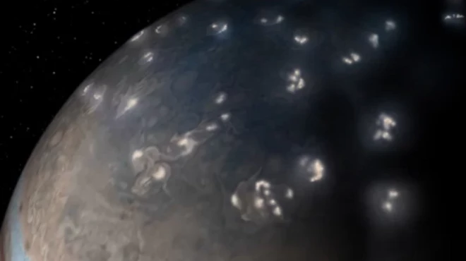 (ภาพจากฝีมือศิลปิน) สายฟ้าแลบที่กระจายตัวอยู่ทั่วกลุ่มพายุหมุนบนดาวพฤหัสบดีมีความคล้ายคลึงกับที่เกิดบนโลก