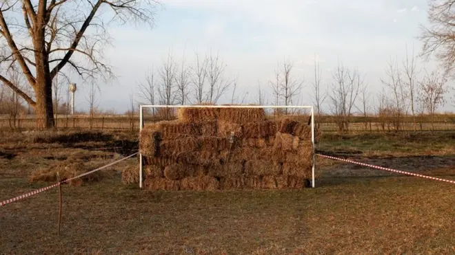 Hay fills a goalpost during the traditional Cossack games outside the village of Arkhonskaya in the Republic of North Ossetia, Alania, Russia