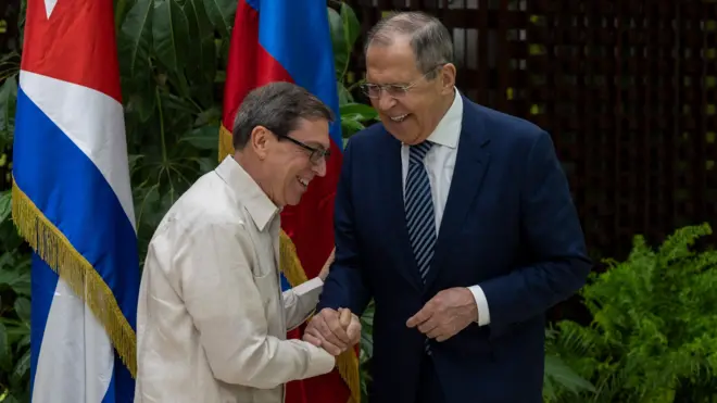 Russian Foreign Minister Sergey Lavrov (R) and Cuba's Minister of Foreign Affairs, Bruno Rodriguez, shake hands during a meeting in Havana on April 20, 2023.