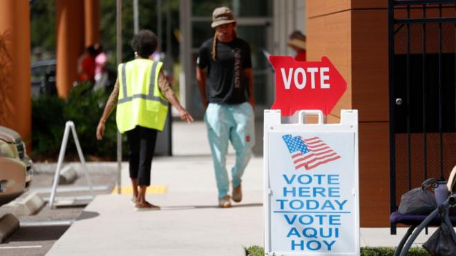 Voters wait in line cast their ballots at the C. Blythe Andrews, Jr. Public Library polling precinct during early voting on November 5, 2022 in Tampa, Florida.