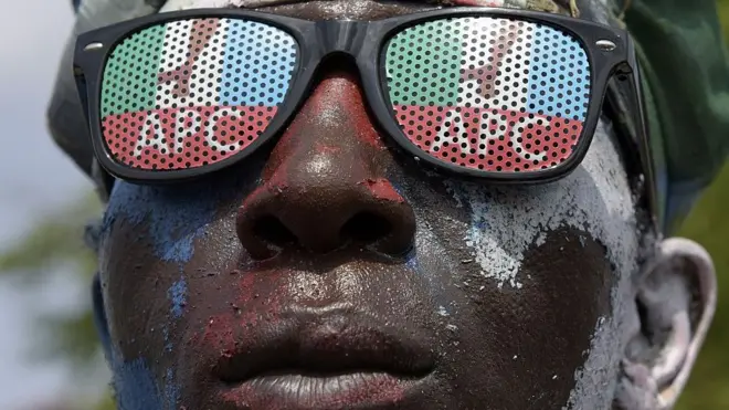 Man wey wear eyeglass with APC logo.