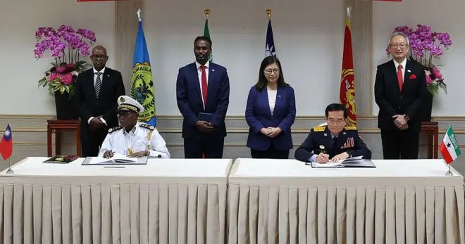 Foreign Minister of the Republic of Somaliland Abdirahman Dahir Adam Bakal, Somaliland Coast Guard Commander Ahmed Hurre Haariye and Taiwan coast guard officials during an agreement signing ceremony, in Taipei, Taiwan, on July 24, 2025