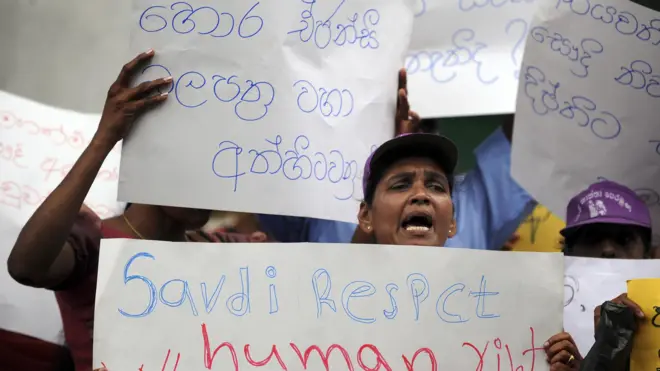 Signboard reads "cancel fraudulent fake agency licences"