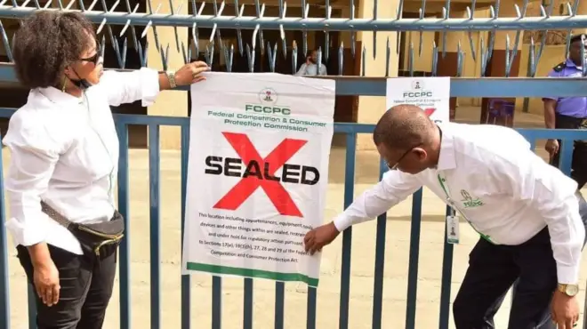 Officials of FCCPC seal Sahad stores, Garki branch, Abuja, Nigeria