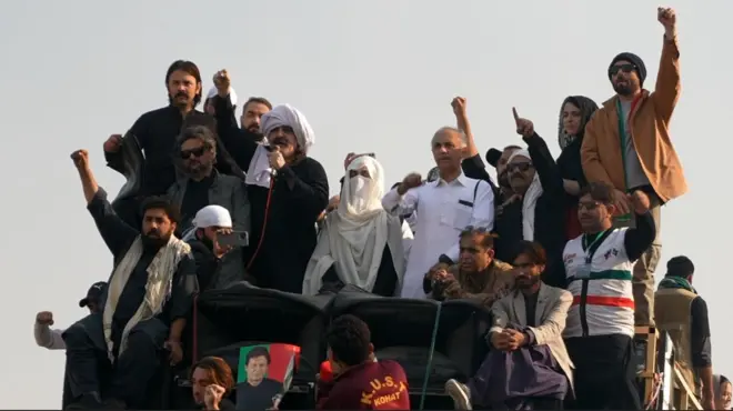 Bushra Bibi seen here on stage standing with leaders of Imran Khan's party during the latest protest in Pakistan.