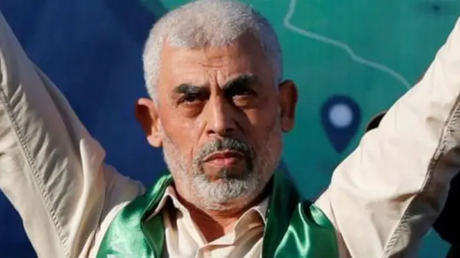 Yahya Sinwar with arms raised