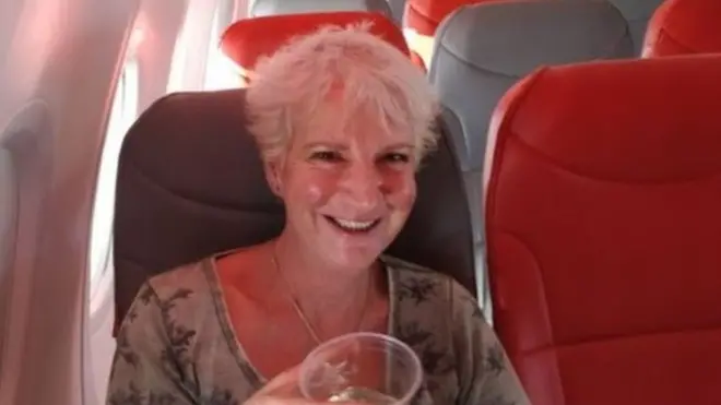 Karon Grieve bin dey travel go Greece to write book.