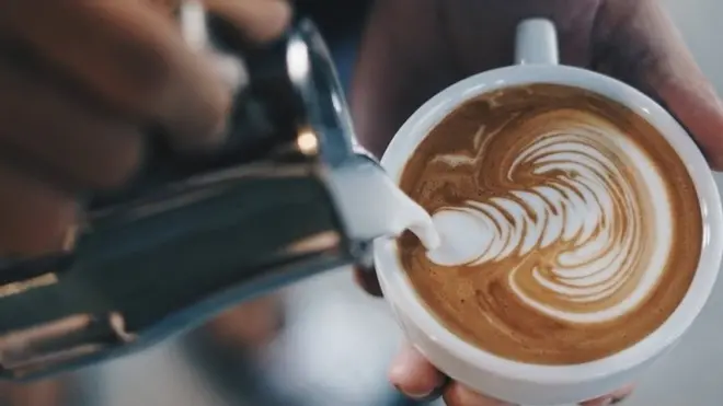 Athenkosi makes latte art