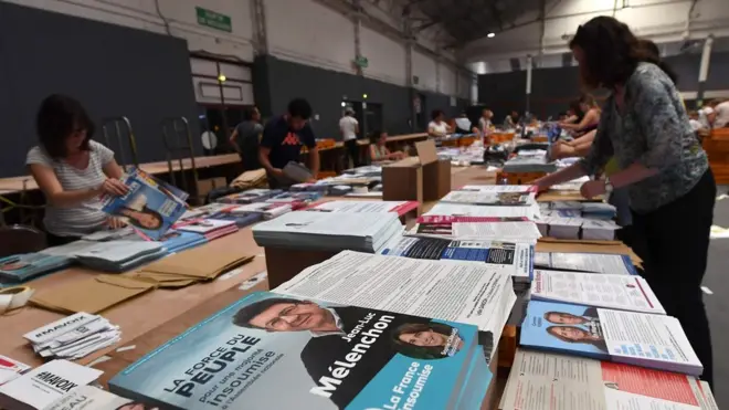 Employees prepare election leaflets for the upcoming French legislative elections on June 2, 2017 in Marseille, southern France