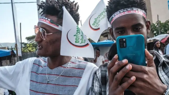 A man taking a picture on the eve of the Irreechaa in Bishoftu, south of Addis Ababa, on October 2, 2021.