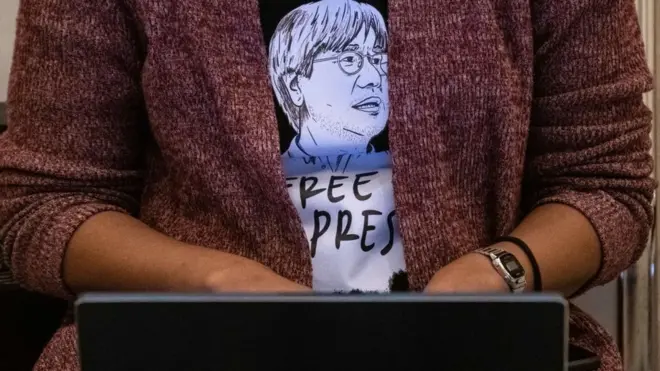 A journalist wears a shirt with an image of Malaysian news site Malaysiakini's editor-in-chief Steven Gan