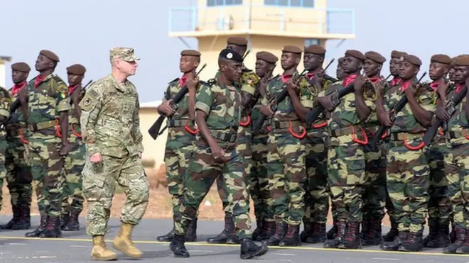 Senegal Army General Amadou Kane and US Army General Donald Bolduc dey check soldiers for Dakar military base.
