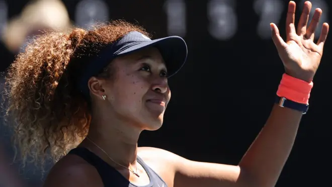 Naomi Osaka waves to the crowd