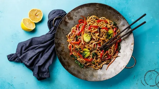 Udon stir fry noodles with oyster mushrooms and vegetables