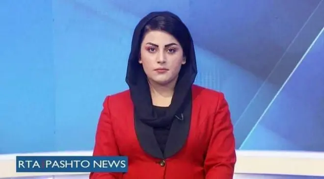 Image of Shabnam Dawran in a news studio wearing a red blazer and black headscarf and the words RTA Pashto News in bottom left hand corner