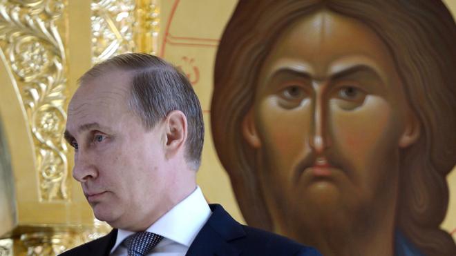 Russian President Vladimir Putin visits a church in 2015.