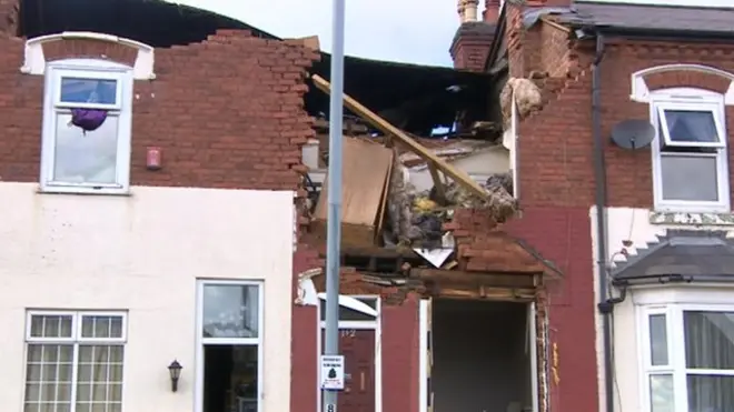 A neighbour told the BBC she saw a man run out from the wreckage screaming.